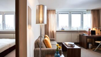 LiV'iN Residence Frankfurt Seilerstraße: Gay-friendly hotel room interior. Features a sofa, desk, and view. Modern design, comfortable stay.