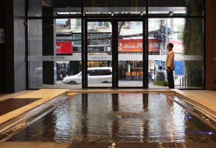 Liberty Central Saigon Citypoint Hotel's entrance with a water feature. This gay-friendly hotel offers a stylish welcome in Saigon.