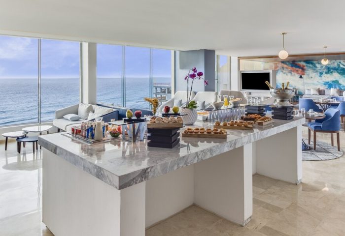Buffet at Live Aqua Beach Resort Cancun, an adults-only, all-inclusive, gay-friendly hotel. Ocean view, lounge seating, and dining area.