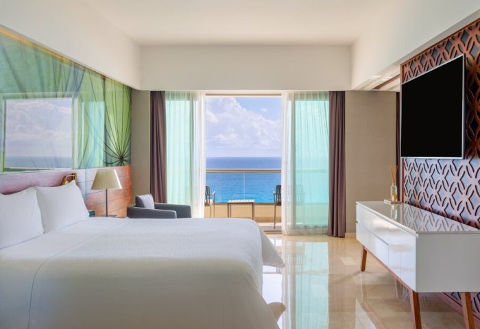 Live Aqua Beach Resort Cancun adults-only suite. Ocean view from balcony. Gay-friendly all-inclusive hotel for LGBTQ+ travel.