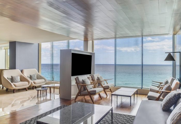 Lounge at Live Aqua Beach Resort Cancun, an adults-only, all-inclusive, gay-friendly hotel. Ocean view seating area.