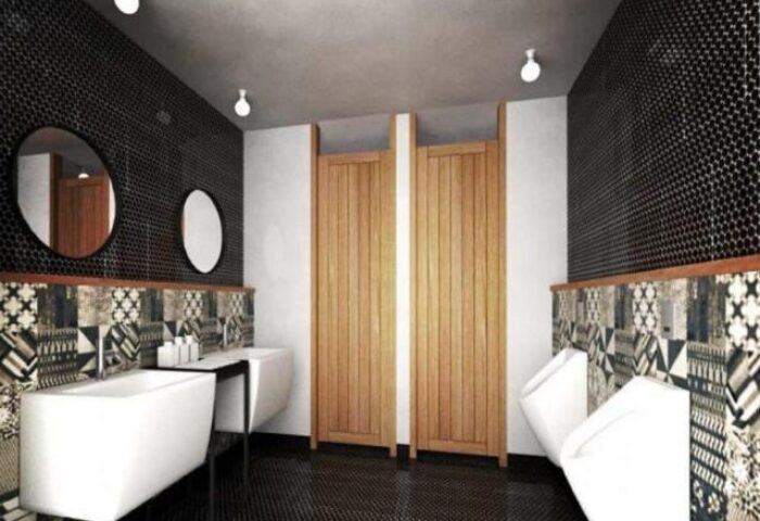 Lub d Phuket Patong gay-friendly hotel bathroom. Modern design with urinals, sinks, mirrors, patterned tiles, and wooden stall doors.