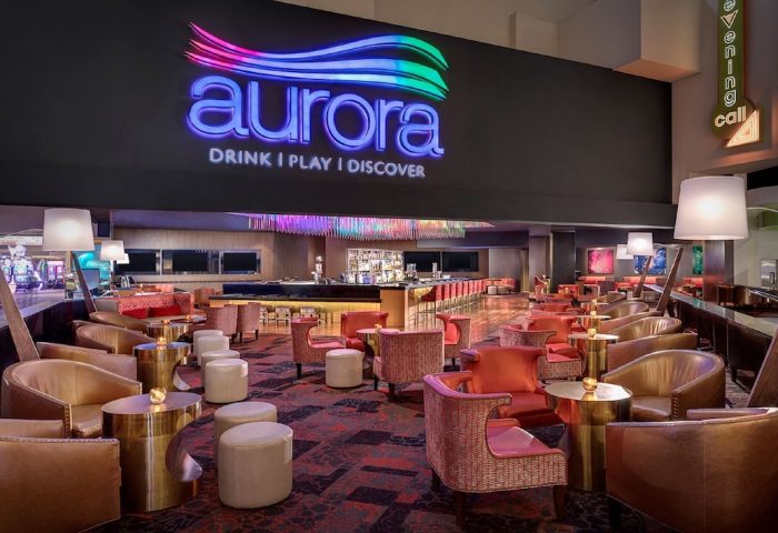 Aurora Bar at Luxor Hotel, a gay-friendly hotel in Las Vegas. The lounge has stylish seating and a modern design.