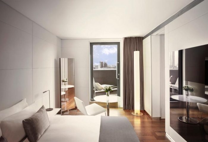 ME London Hotel's gay-friendly room. Balcony view, modern design, pet-friendly. Ideal for gay travel, luxury stay in London.