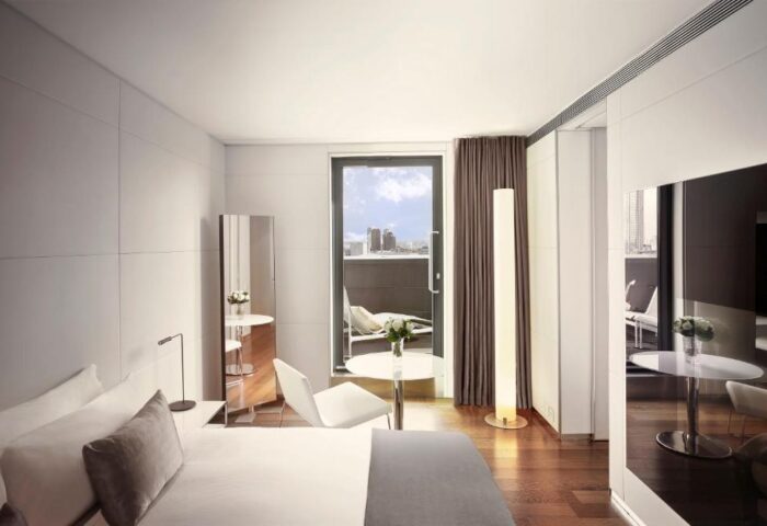 ME London Hotel's gay-friendly room. Balcony view, modern design, pet-friendly. Ideal for gay travel, luxury stay in London.