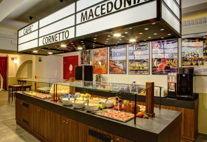 MEININGER Roma Termini's breakfast buffet. Gay-friendly hotel with a variety of food options, including pastries, fruit, and coffee.