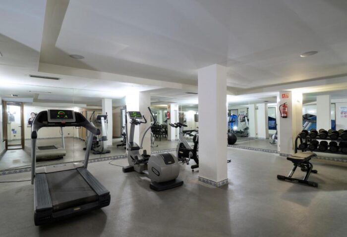 MS Aguamarina Suites gay-friendly hotel gym. Treadmill, elliptical, and weight rack for fitness. A great amenity for gay travelers.