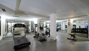 MS Aguamarina Suites gay-friendly hotel gym. Treadmill, elliptical, and weight rack for fitness. A great amenity for gay travelers.