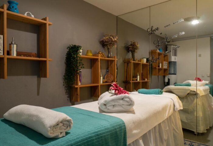 MS Aguamarina Suites gay-friendly hotel spa room. Massage beds, shelves, towels, and relaxing decor. Perfect for gay men's vacations.