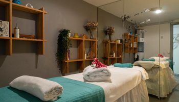 MS Aguamarina Suites gay-friendly hotel spa room. Massage beds, shelves, towels, and relaxing decor. Perfect for gay men's vacations.