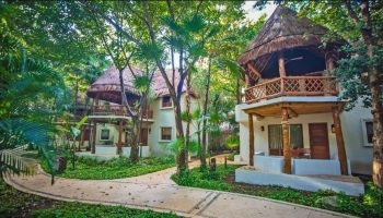 Mahekal Beach Front Resort and Spa: Gay-friendly hotel with thatched-roof bungalows in a lush, tropical setting. Ideal for gay men travel.
