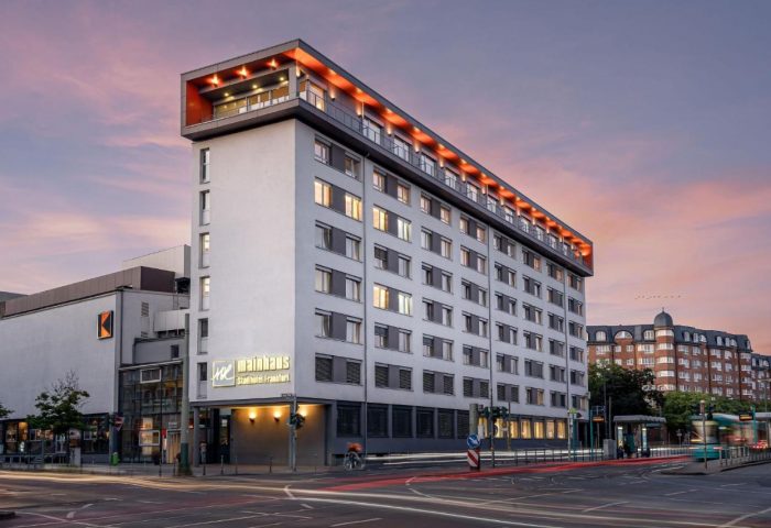 Mainhaus Stadthotel Frankfurt, a gay-friendly hotel. Exterior view of the hotel at dusk. Ideal for gay travelers in Frankfurt.