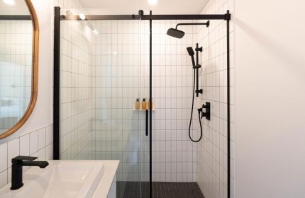 Maison Place Royale bathroom. Modern shower with black fixtures at this gay-friendly hotel by Luxury In Transit. Tile detail.