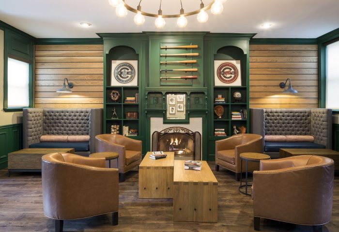 Majestic Hotel Chicago's gay-friendly lounge. Leather chairs, fireplace, and baseball decor create a cozy, inviting space.