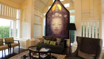 Makka Hotel's lobby. Gay-friendly hotel interior. Buddha art, seating area, and natural light create a serene, welcoming space for gay travelers.