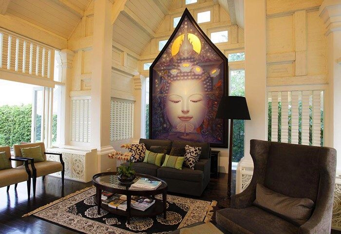 Makka Hotel's lobby. Gay-friendly hotel interior. Buddha art, seating area, and natural light create a serene, welcoming space for gay travelers.