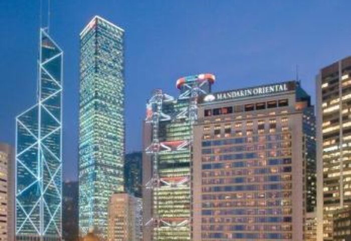 Mandarin Oriental Hong Kong, a gay-friendly hotel. Night view of the hotel and cityscape. Travel advice for gay men in Hong Kong.