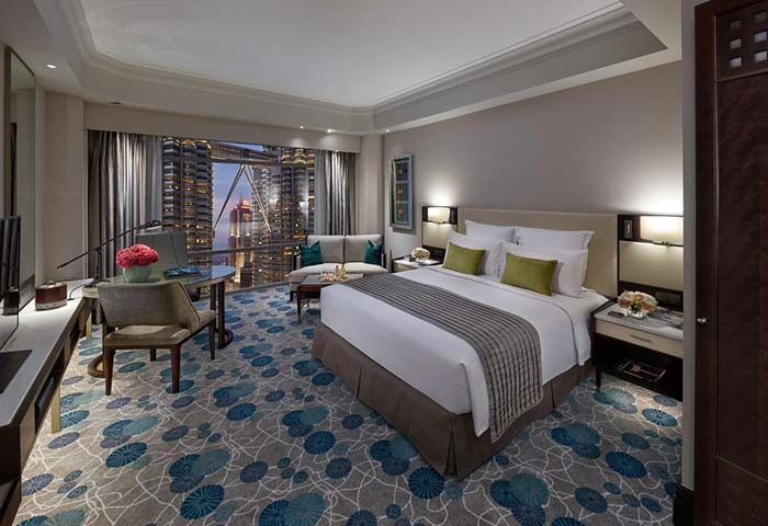 Gay-friendly Mandarin Oriental Kuala Lumpur hotel room with Petronas Twin Towers view. Luxury gay travel in Malaysia.