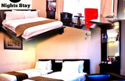Gay-friendly Manhattan Hotel room featuring king and twin beds. Minimum 3 nights stay. Upscale lodging for gay travelers in NYC.