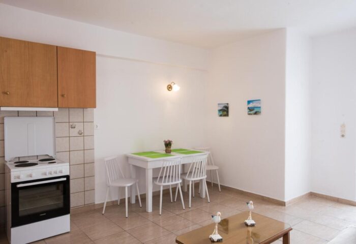 Marina Blue Ornos gay-friendly hotel room. Kitchenette, dining table, and decor. A comfortable space for gay travelers in Ornos, Mykonos.