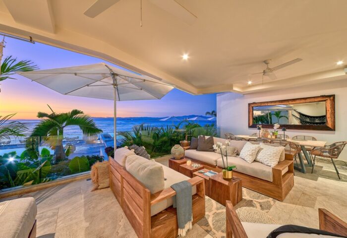 Maxwell Residences at Indah: Gay-friendly hotel balcony view. Outdoor seating, sunset ocean view. Tropical, luxurious gay travel destination.