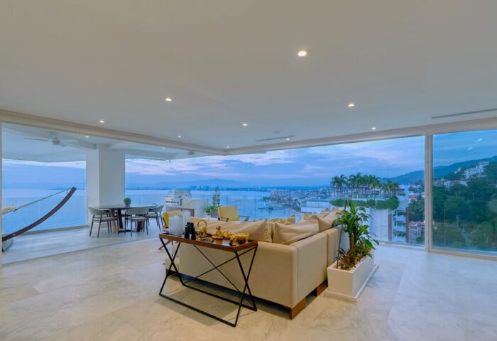 Maxwell Residences at Indah view. Gay-friendly hotel suite with ocean view, hammock, dining table, and sofa. Perfect for gay travel.