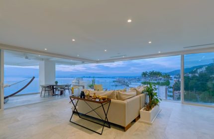 Maxwell Residences at Indah view. Gay-friendly hotel suite with ocean view, hammock, dining table, and sofa. Perfect for gay travel.
