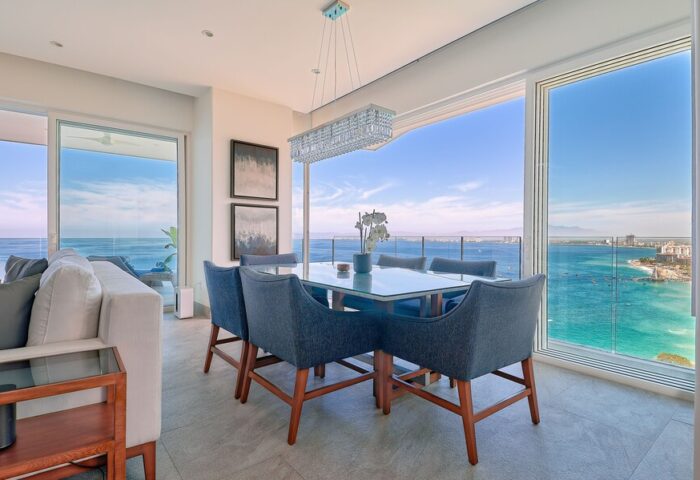 Maxwell Residences at Indah dining area with ocean view. Gay-friendly hotel offers luxury travel for gay men. Modern interior design.