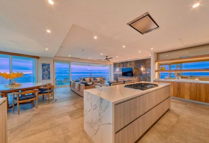 Maxwell Residences at Indah interior. Gay-friendly hotel with ocean view. Modern kitchen, living room, and dining area. Luxury Indah stay.