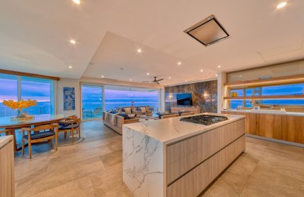 Maxwell Residences at Indah interior. Gay-friendly hotel with ocean view. Modern kitchen, living room, and dining area. Luxury Indah stay.