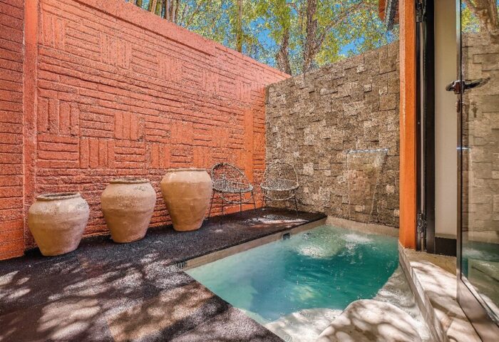 Maxwell Residences at Indah gay-friendly hotel: Private plunge pool with waterfall feature, pots, and chairs on the patio.
