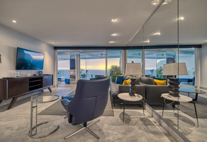 Maxwell Residences at Indah living room. Gay-friendly hotel with ocean view. Modern interior design, comfortable seating, and stylish decor.