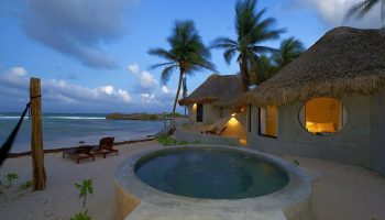 Gay-friendly Maya Tulum By G Hotels: Beachfront bungalows with thatched roofs, private pool, and ocean views. Perfect for gay travel in Tulum.
