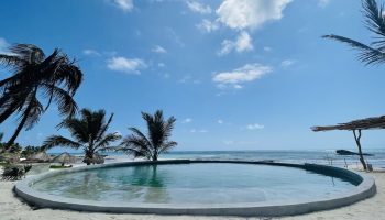 Maya Tulum By G Hotels: Round pool at this gay-friendly hotel. Beachfront view with palm trees. Ideal for gay men's travel.