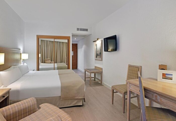Melia Costa del Sol gay-friendly hotel room. Clean, modern design with a double bed, desk, and TV. Perfect for gay men's travel to Spain.
