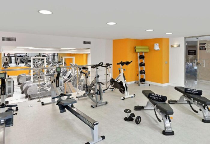 Melia Costa del Sol's gym. This gay-friendly hotel offers a fitness room with cardio machines, weights, and benches for a complete workout.