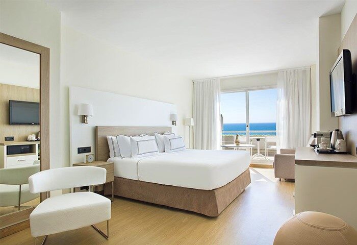 Melia Sitges gay-friendly hotel room. Bright, modern interior with sea view balcony. Ideal for gay travel in Sitges, Spain.