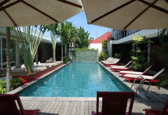 Pool view at gay-friendly Men's Resort & Spa, a gay hotel. Loungers line the pool deck. This gay resort offers relaxation and a welcoming space.