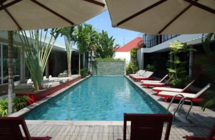 Pool view at gay-friendly Men's Resort & Spa, a gay hotel. Loungers line the pool deck. This gay resort offers relaxation and a welcoming space.