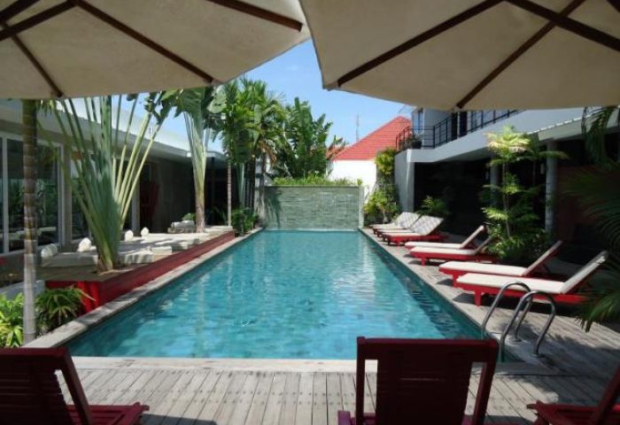 Pool view at gay-friendly Men's Resort & Spa, a gay hotel. Loungers line the pool deck. This gay resort offers relaxation and a welcoming space.
