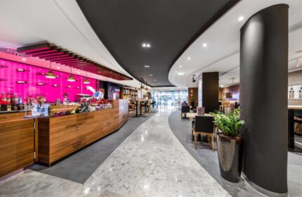 Mercure Budapest City Center Hotel's stylish lobby bar. Gay-friendly hotel with modern design, pink accents, and comfortable seating. #Budapest #Hotel