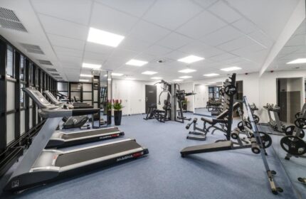 Gym at Gay-Friendly Mercure Budapest City Center Hotel. Treadmills, weights, and machines in a well-lit fitness center. Workout while you travel.