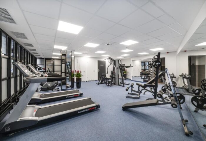 Gym at Gay-Friendly Mercure Budapest City Center Hotel. Treadmills, weights, and machines in a well-lit fitness center. Workout while you travel.
