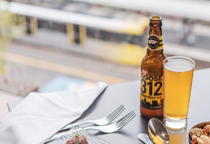 Fine dining at Mercure Manchester Piccadilly Hotel, a gay-friendly hotel. Beer, appetizer, and city view. Manchester travel advice.