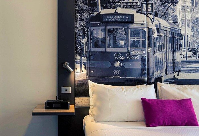 Mercure Melbourne Therry Street gay-friendly hotel room with a tram mural above the bed. Modern design, comfortable for gay travelers.