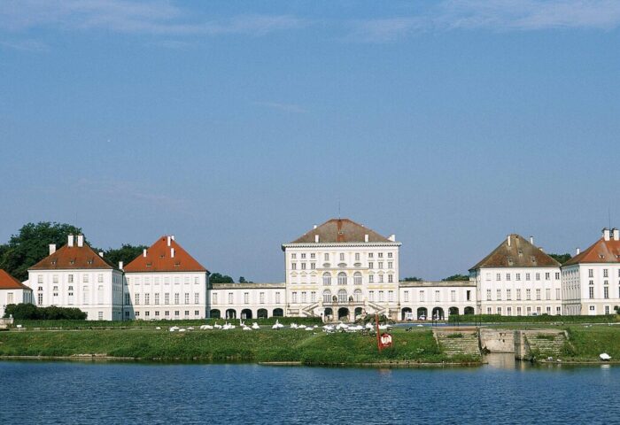 Gay-friendly Mercure Munich City Center Hotel view: Nymphenburg Palace, Munich. Swans on the lawn, palace reflected in water.