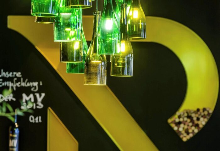 Mercure Munich City Center Hotel's bar area. Green bottle chandelier. Gay-friendly hotel with stylish decor. Munich travel tips.