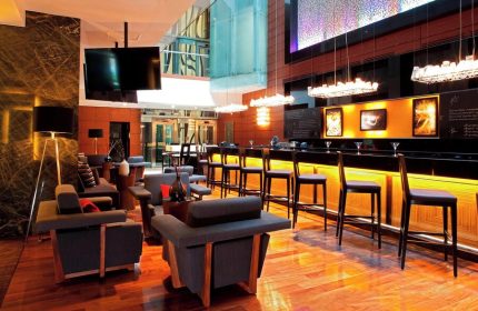 Mexico City Marriott Reforma Hotel bar area. Gay-friendly hotel with modern design, bar stools, and lounge seating. Ideal for gay travel.