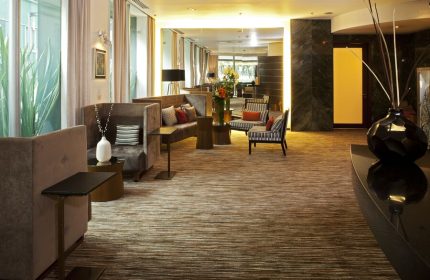 Mexico City Marriott Reforma Hotel lobby seating area. Gay-friendly hotel with comfortable sofas and chairs. Interior design details.