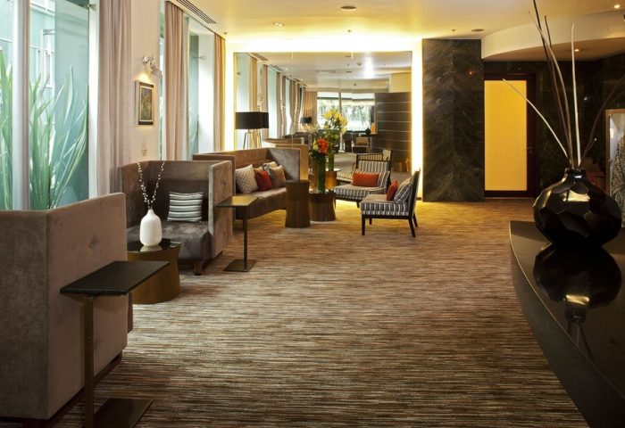 Mexico City Marriott Reforma Hotel lobby seating area. Gay-friendly hotel with comfortable sofas and chairs. Interior design details.